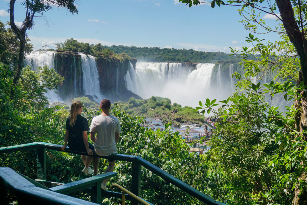 man and woman looking at the iguazu waterfalls 2026 03 20 03 28 01 utc